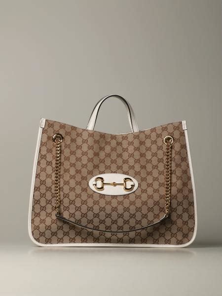 gucci b4|white Gucci shopping bag.